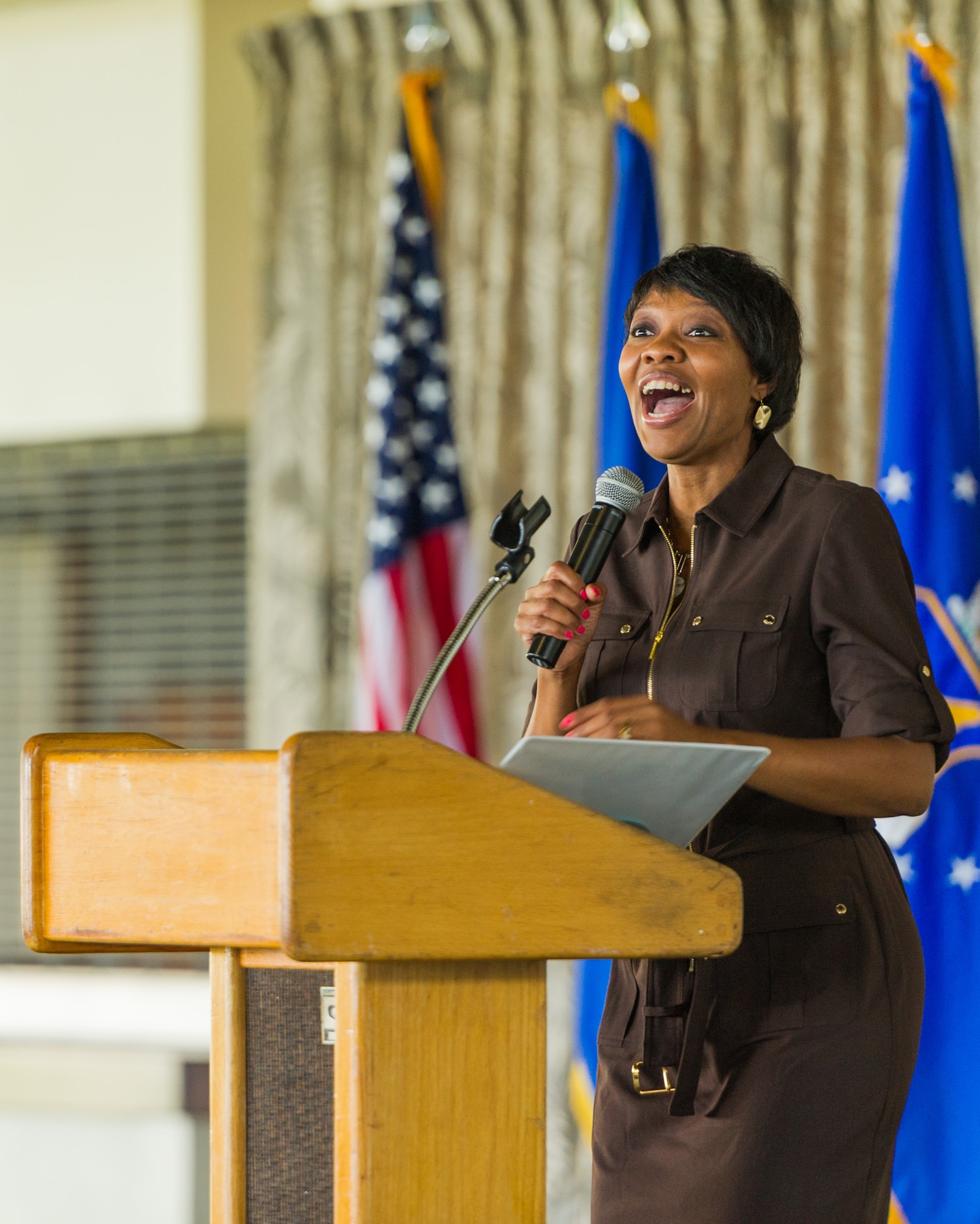 U.S. Air Force Machelle Terrell, 15th Wing installation sexual assault response coordinator,  reacts to a question asked during Pacific Air Forces' Sexual Assault Prevention and Response training day, Joint Base Pearl Harbor-Hickam, Apr. 28, 2015.  The training is an annual training requirement for all Airmen and addressed a number of topics ranging from defining sexual harassment to  eliminating sexual assault in the Air Force through professional, respectful behavior.     (U.S. Air Force photo by Tech. Sgt. James Stewart/Released)