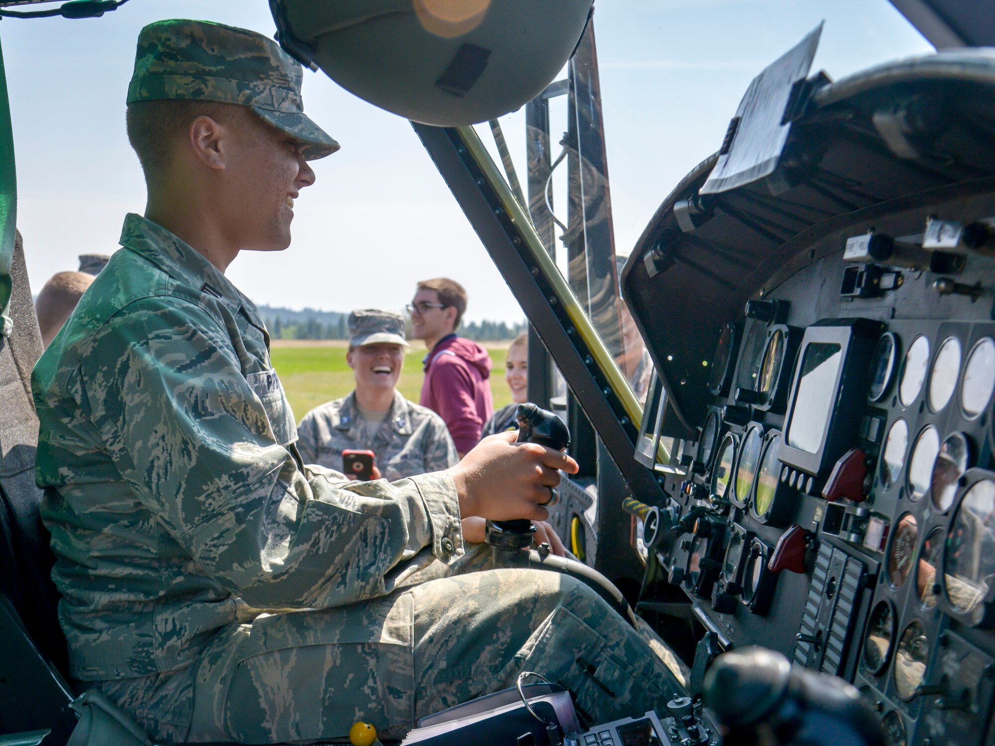 A Washington State University Air Force ROTC cadet takes the stick of a 36th Rescue Flight UH-1N Iroquois helicopter during the cadets’ tour of the base May 1, 2015, at Fairchild Air Force Base, Wash. The UH-1N is a light-lift utility helicopter primarily used for missions including airlift of emergency security forces and distinguished visitor airlift. Community engagement activities like these showcase Air Force capabilities to the public increasing trust, support and in the case of AFROTC, interest in joining the Air Force. (U.S. Air Force photo/Senior Airman Janelle Patiño)
