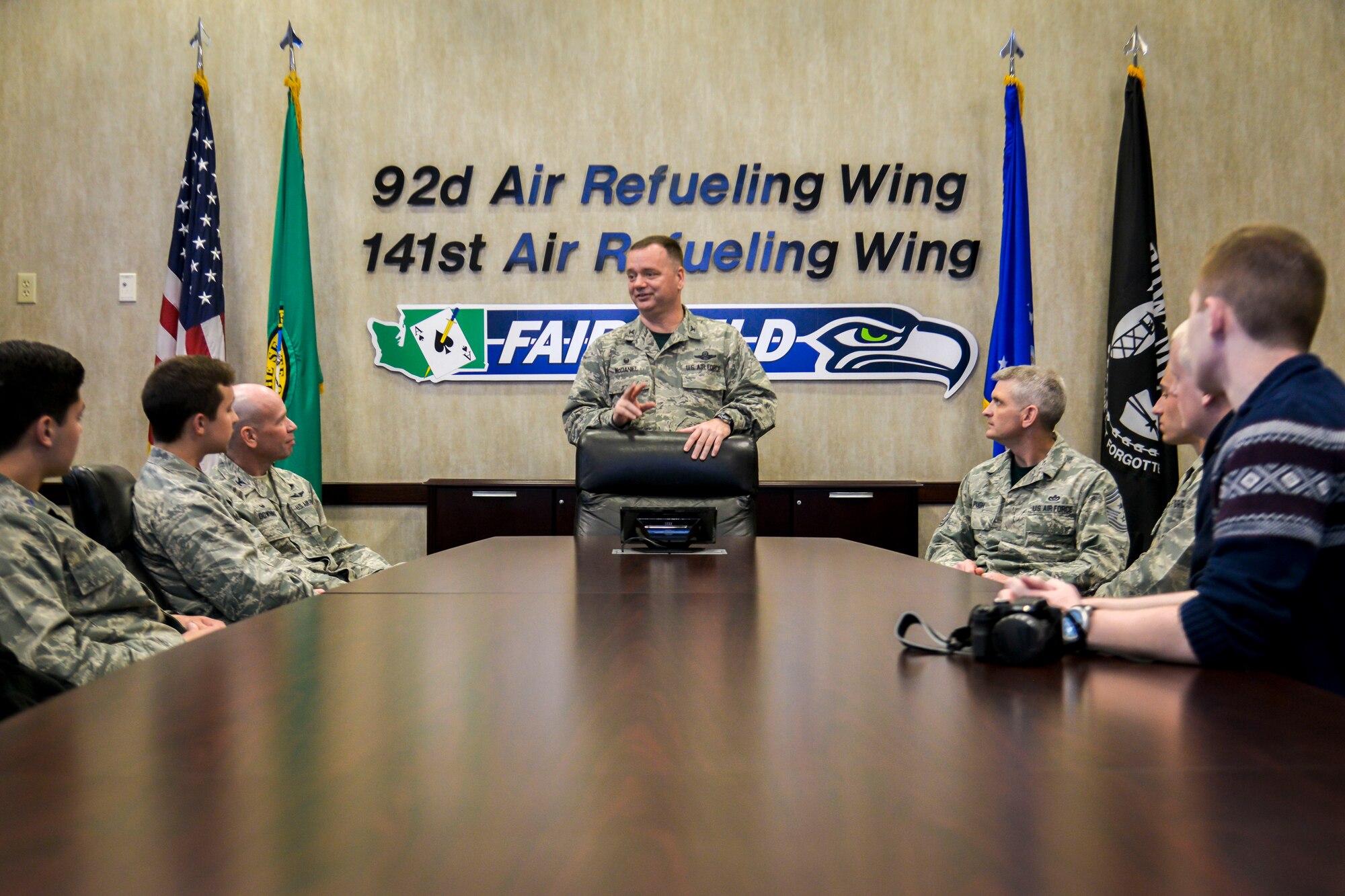 Col. Brian McDaniel, the 92nd Air Refueling Wing commander, shares military service advice with Washington State University Air Force ROTC cadets during their tour of the base May 1, 2015, at Fairchild Air Force Base, Wash. The tour included stops at the base headquarters for a mission briefing from the installation commander, a KC-135 Stratotanker static display and the Survival, Evasion, Resistance and Escape School for a UH-1N Iroquois helicopter static and flying demonstration. (U.S. Air Force photo/Senior Airman Janelle Patiño)