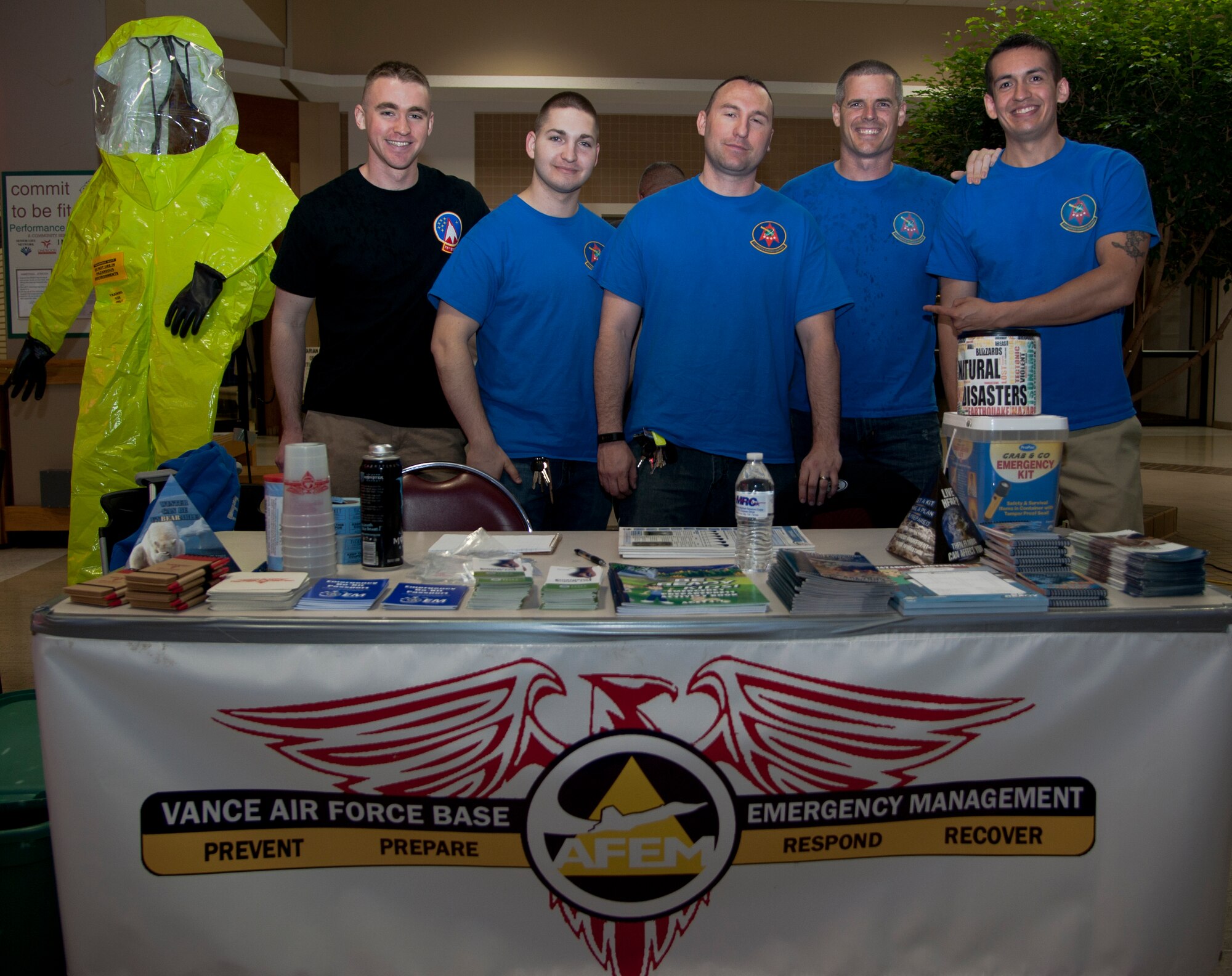 Members from the 71st Logistics Readiness Squadron Emergency Management Flight stand in front of their booth during the 4th Annual Weather and Disaster Preparedness Day April 8 at the Oakwood Mall in Enid, Oklahoma. The Airmen joined emergency management personnel from across Garfield County to hand out preparedness information to the local community. (U.S. Air Force Photo/Staff Sgt. Nancy Falcon)