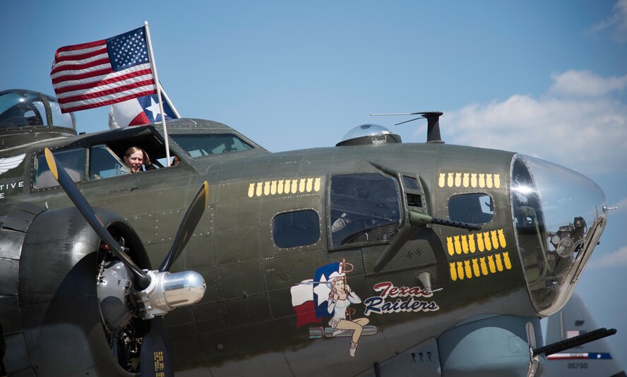 Capt. Denise Duriga, 11th Wing Protocol chief, looks out the window of the B-17G Texas Raiders at Joint Base Andrews, Md., May 4, 2015. Texas Raiders is one of two in the Commemorative Air Force organization and one of 11 still flying. (U.S. Air Force photo/Airman 1st Class Philip Bryant)