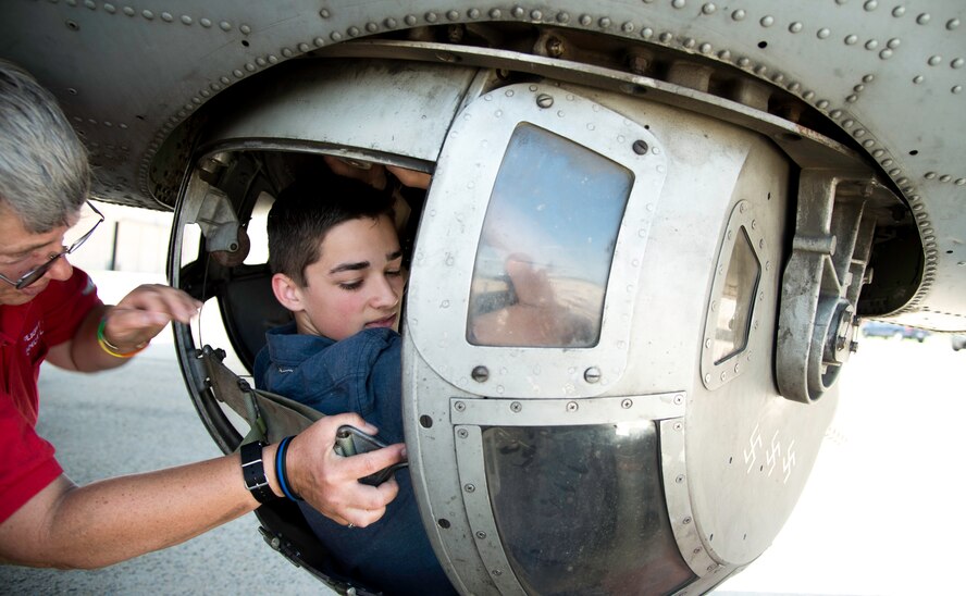 Braden Licciardi, an event participant, gets inside the ball turret of the B-17G Texas Raiders at Joint Base Andrews, Md., May 4, 2015. (U.S. Air Force photo/Airman 1st Class Philip Bryant)