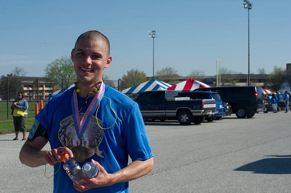 Airman 1st Class Joshua Islas, 11th Wing Staff Agency administrative technician, smiles for a photo after taking fourth place at the Joint Base Andrews Half-Marathon here, April 18, 2015. (U.S. Air Force photo by Senior Airman Mariah Haddenham)