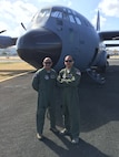 Tech. Sgt. Edwin Martinez and Tech. Sgt. Moises Ostolaza, Ravens with the 482nd Security Forces Squadron at Homestead Air Reserve Base, Fla., pose next to the WC-130J during the Caribbean Hurricane Awareness Tour April 26. They supported the tour by ensuring the security of the members and equipment and both members are bilingual so they also translated for the team. (Courtesy photo)