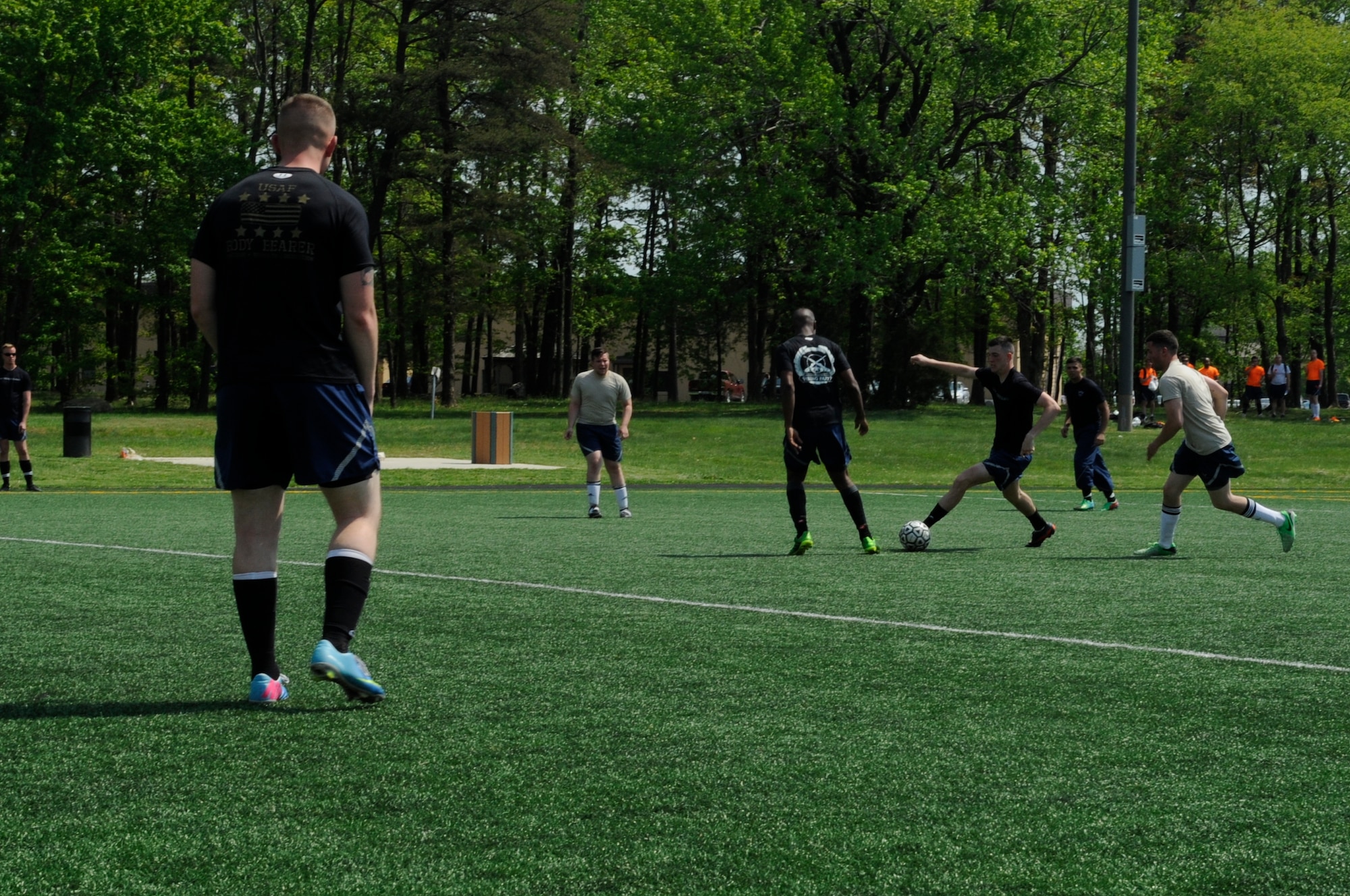 The 11th Security Forces Group and 11th Operations Group face off during the championship soccer game during Wingman Day here, May 5, 2015. 11th OG received a trophy for winning the soccer tournament. (U.S. Air Force photo by Senior Airman Mariah Haddenham)