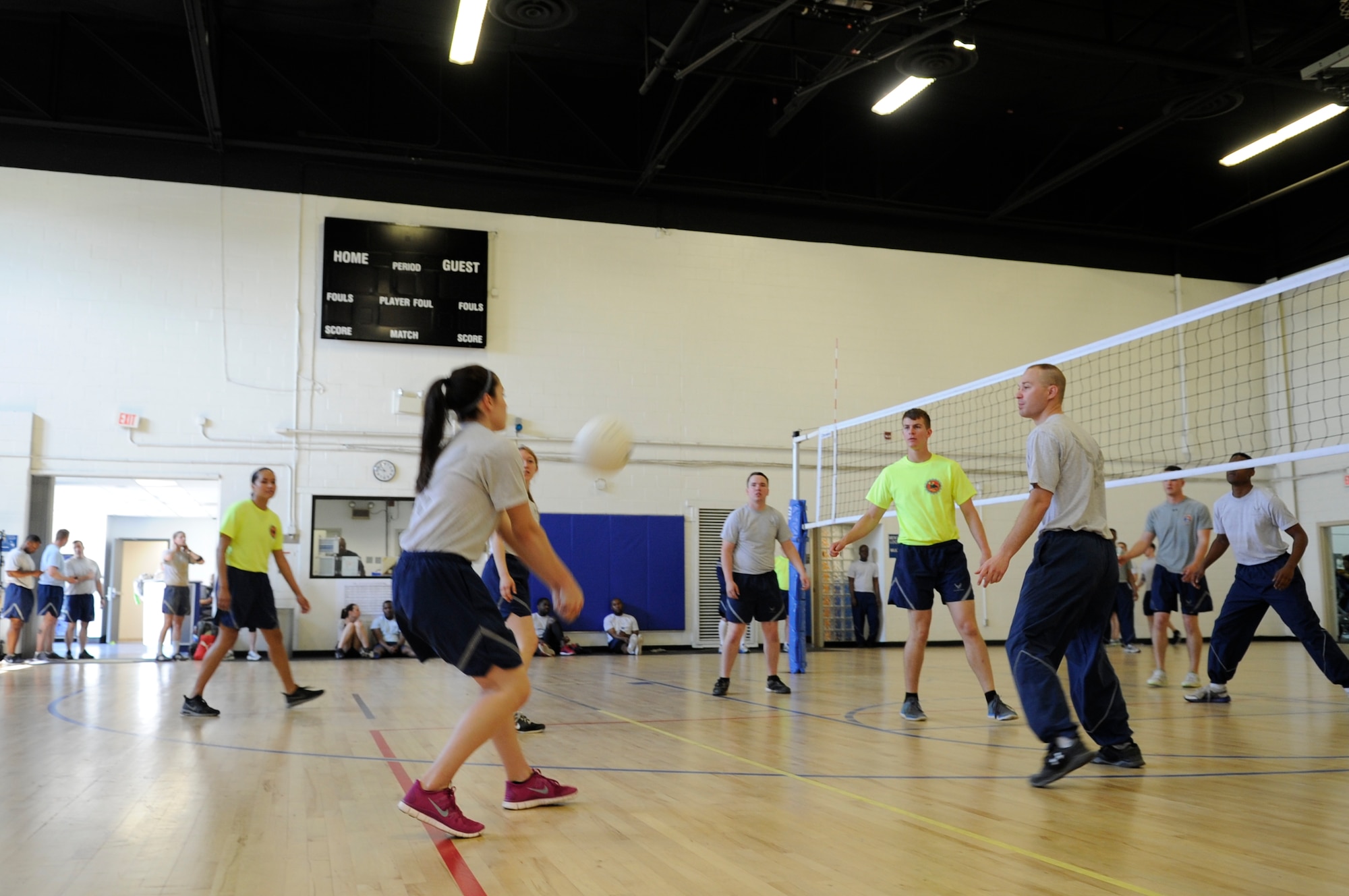 Airman Marlene Zeledon, 11th Civil Engineer Squadron Emergency Management Flight apprentice hits avolleyball during a match at Wingman Day here, May 5, 2015. (U.S. Air Force photo by Senior Airman Mariah Haddenham)