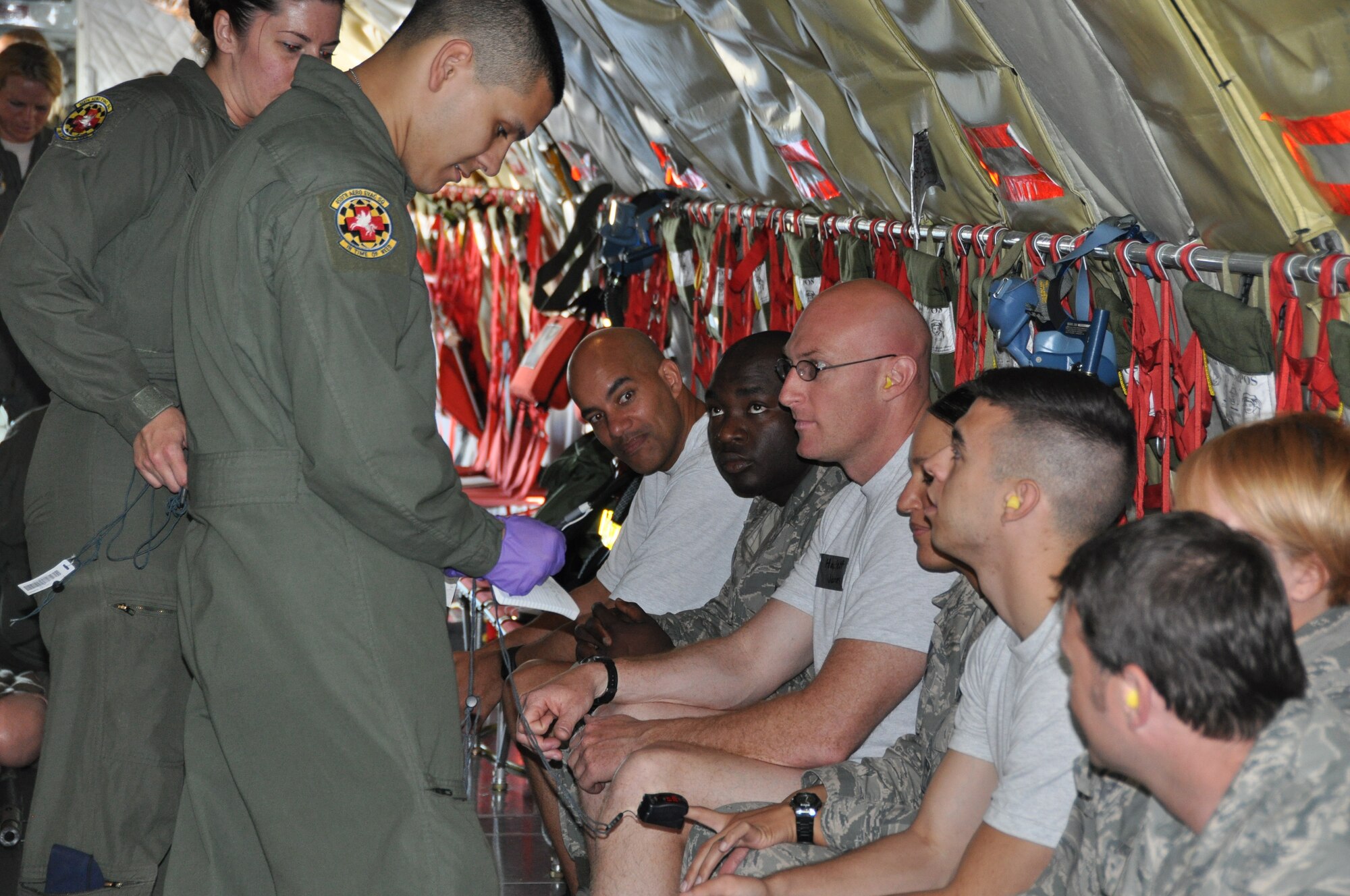 Members of the 459th Aeromedical Evacuation Squadron go over safety procedures and provide last minute medical care to patients before the aerial evacuation takes place. The exercise mimicked emergency medical situation in the event of a disaster at Joint Base Andrews on Monday, May 4, 2015 (Air Force Photo / Senior Airman Kristin Kurtz)