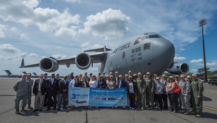 Base leadership and honorary commanders pose for a group photo in front of a C-17 Globemaster III May 5, 2015 at Joint Base Charleston, S.C., during an event celebrating the C-17 surpassing the three millionth flying hour.  Aircrew members from JB Charleston flew the plane here from Robins Air Force Base, Ga. The first C-17 flight was Sept. 15, 1991 and the Air Force currently has 222 C-17’s in the fleet. (U.S. Air Force photo/Senior Airman Jared Trimarchi) 