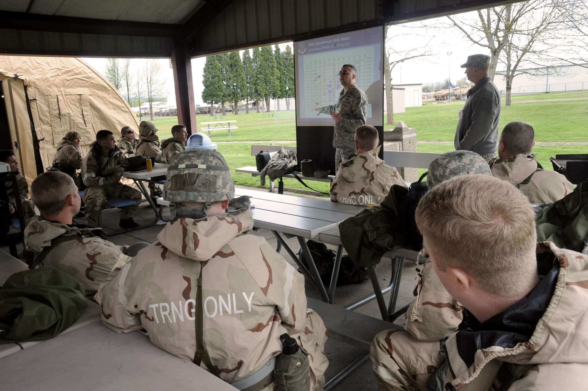 Oregon Air National Guard Chief Master Sgt. John McIlvain, Emergency Management Superintendent, delivers training information during one of the eight stations set up for the AEF Skills Rodeo, April 12, 2015, Portland Air National Guard Base, Ore. (U.S. Air National Guard photo by Tech. Sgt. John Hughel, 142nd Fighter Wing Public Affairs/Release)
