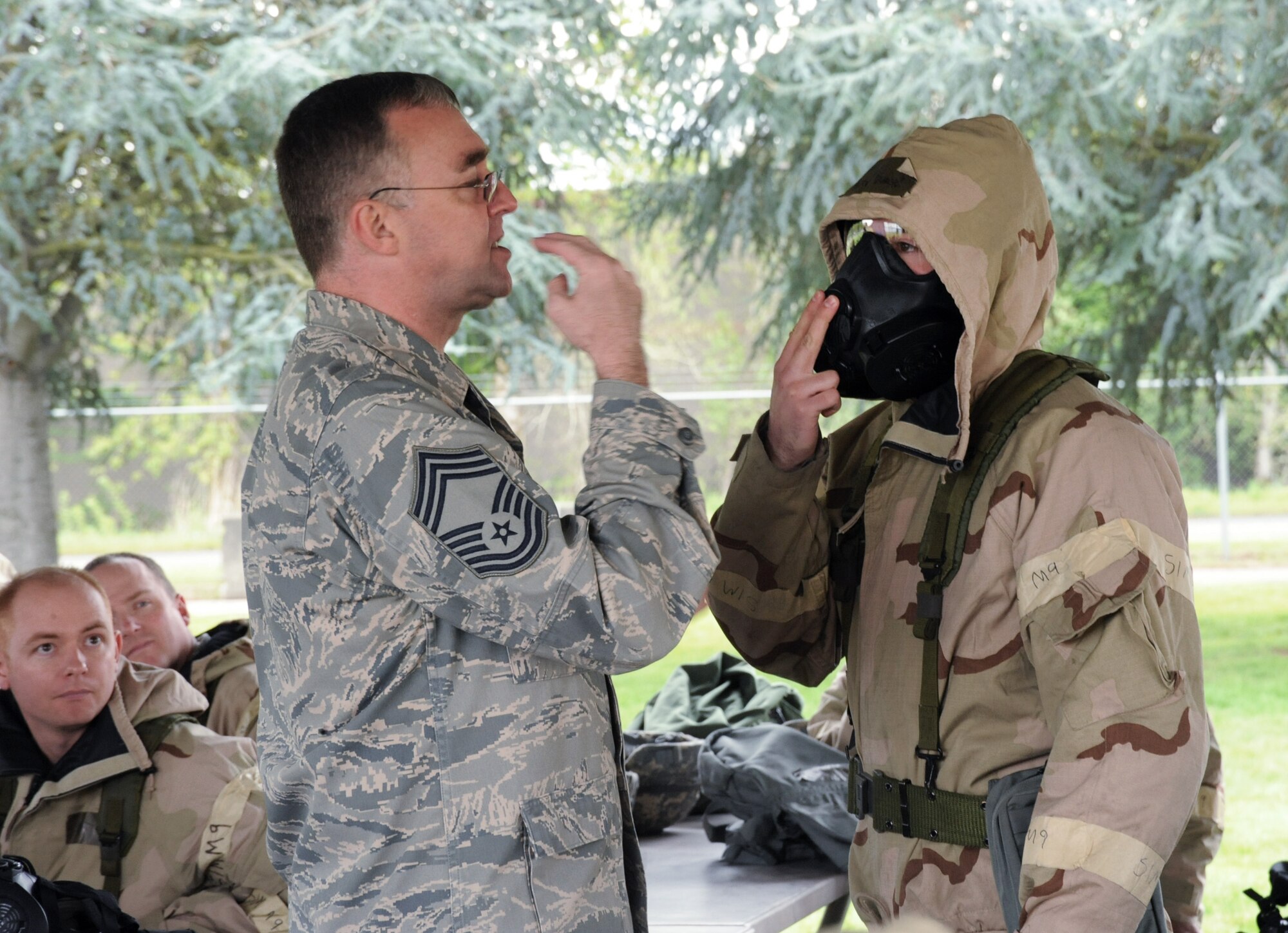 Oregon Air National Guard Chief Master Sgt. John McIlvain, base emergency manager assigned to the 142nd Fighter Wing Civil Engineering Squadron, gives a hands on demonstration during the AEF Skills Rodeo, April 12, 2015, Portland Air National Guard Base, Ore. (U.S. Air National Guard photo by Tech. Sgt. John Hughel, 142nd Fighter Wing Public Affairs/Release)