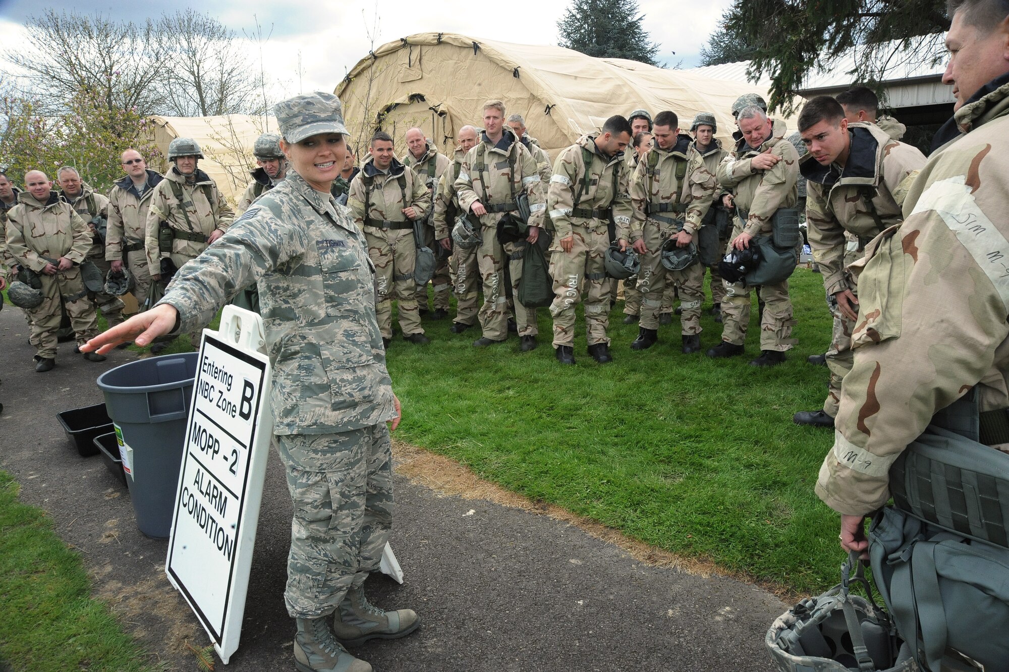 Oregon Air National Guard Staff Sgt. Alica Tishmack, assigned to the 142nd Fighter Wing Civil Engineer Squadron, guides a group during training at the AEF Skills Rodeo at the Portland Air National Guard Base, April 12, 2015. (U.S. Air National Guard photo by Tech. Sgt. John Hughel, 142nd Fighter Wing Public Affairs/Release)
