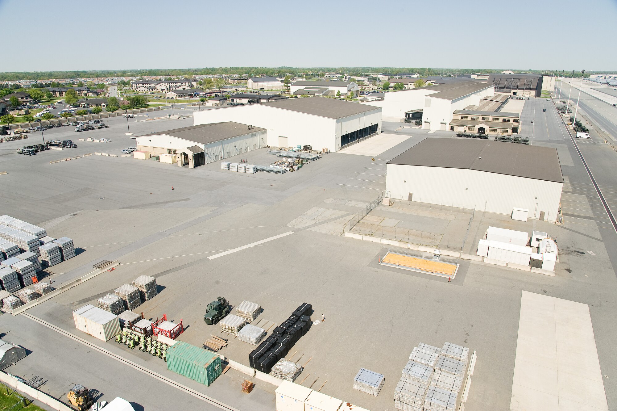 A bird's eye view of the 436th Aerial Port Squadron May 4, 2015, from the control tower catwalk on Dover Air Force Base, Del. The 436th APS is the Department of Defense's largest aerial port that supports Air Mobility Command channel, contingency, humanitarian and exercise missions. Aerial Porters load and unload approximately 5,000 commercial and military aircraft annually. (U.S. Air Force photo/Roland Balik)