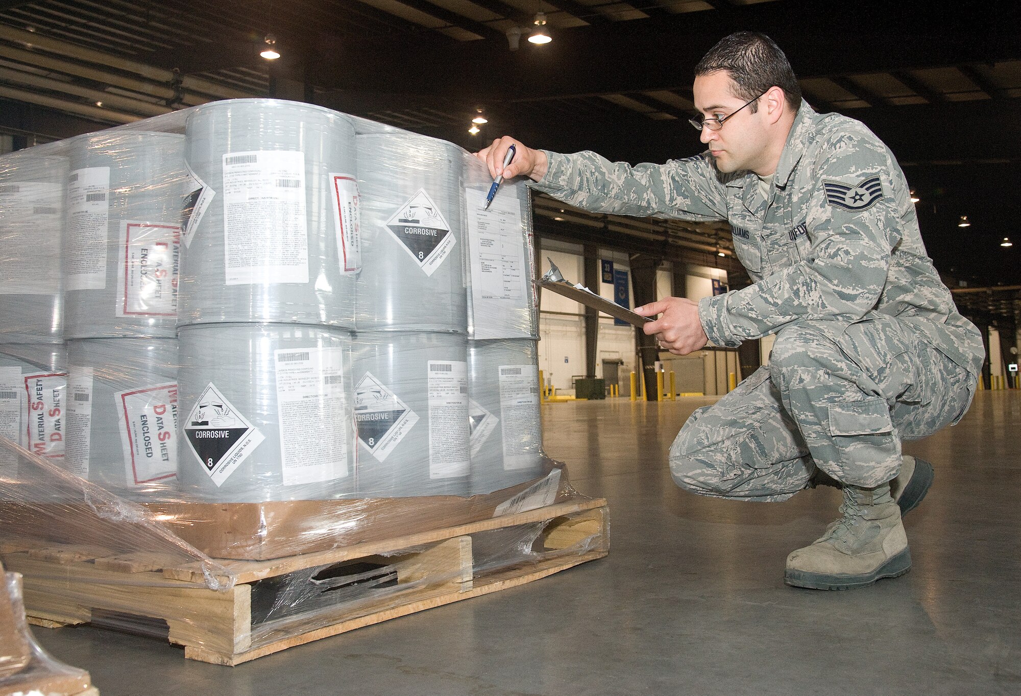 Staff Sgt. Robert Williams, 436th Aerial Port Squadron dayshift truck dock NCO in charge, checks the pallet shipping information label on newly arrived freight May 4, 2015, at the truck dock on Dover Air Force Base, Del. The truck dock handles a wide variety of packaged cargo needing to be airlifted to other locations or for use at Dover AFB. In fiscal year 2014, the truck dock handled more than 7,700 trucks containing 122,406 items. (U.S. Air Force photo/Roland Balik)