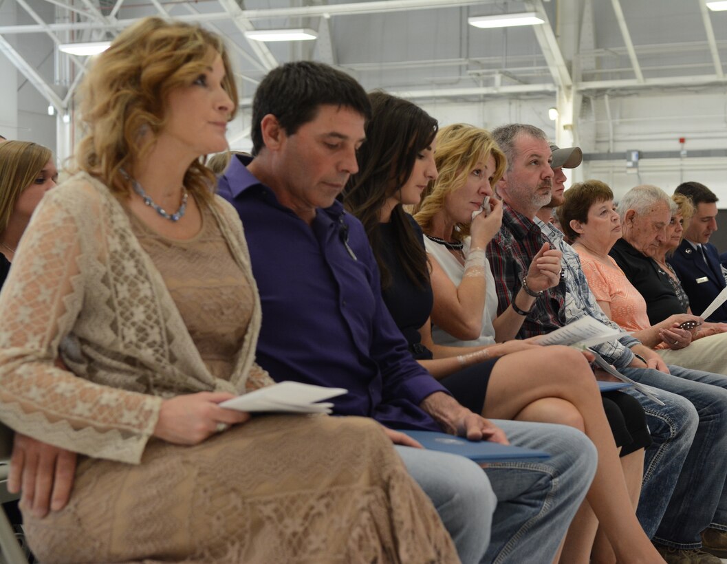 Airmen of the 115th Fighter Wing, family members and friends gathered to honor Airman 1st Class Kelly C. Tomfohrde's service, sacrifices and to recognize her achievements and dedication during the memorial service on base. (U.S. Air National Guard photo by Tech. Sgt. Tiffany Black)