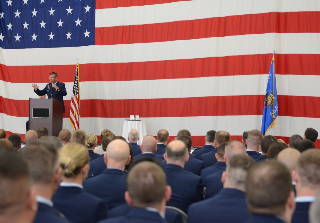 Major Donald J. Heiar, 115th Fighter Wing chaplain, delivers scripture and a reflection during Airman 1st Class Kelly C. Tomfohrde's memorial service, May 3. Airmen of the 115 FW, family members and friends gathered to honor Tomfohrde's service, sacrifices and to recognize her achievements and dedication during the memorial service on base. (U.S. Air National Guard photo by Tech. Sgt. Tiffany Black)