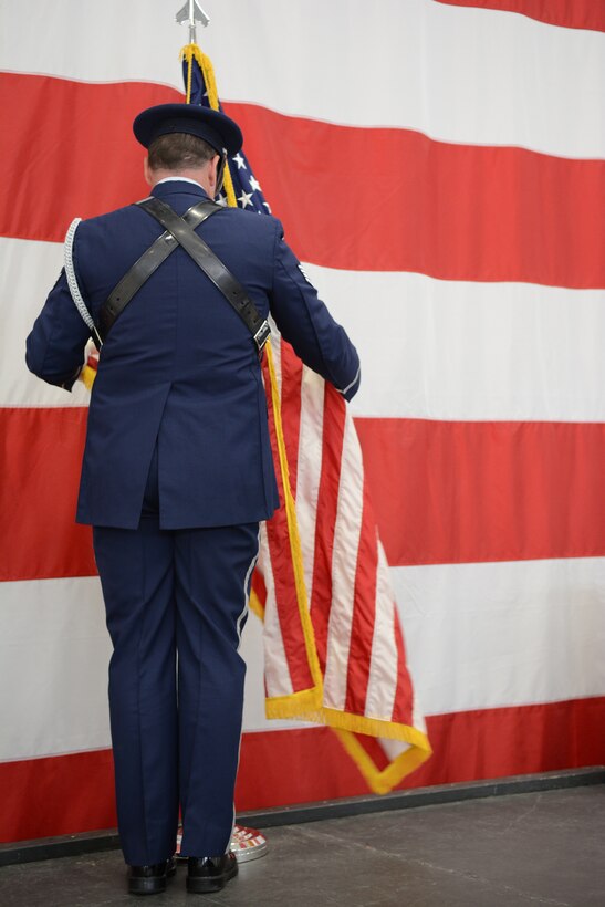 Master Sgt. Richard Goddard,115th Fighter Wing Honor Guard, posts the colors during Airman 1st Class Kelly C. Tomfohrde's memorial service, May 3. Airmen of the 115 FW, family members and friends gathered to honor Tomfohrde's service, sacrifices and to recognize her achievements and dedication during the memorial service on base. (U.S. Air National Guard photo by Tech. Sgt. Tiffany Black)