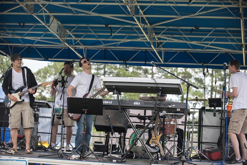 Local band, Zero to Never, rocks out during the annual base picnic May 1, 2015 at Joint Base Charleston, S.C. The two-day event included free food, live music, an inflatable obstacle course, a rock-climbing wall, a military working dog demo, prizes and demonstrations from local organizations. These organizations support service members throughout the year. (U.S. Air Force photo/Senior Airman Jared Trimarchi) 