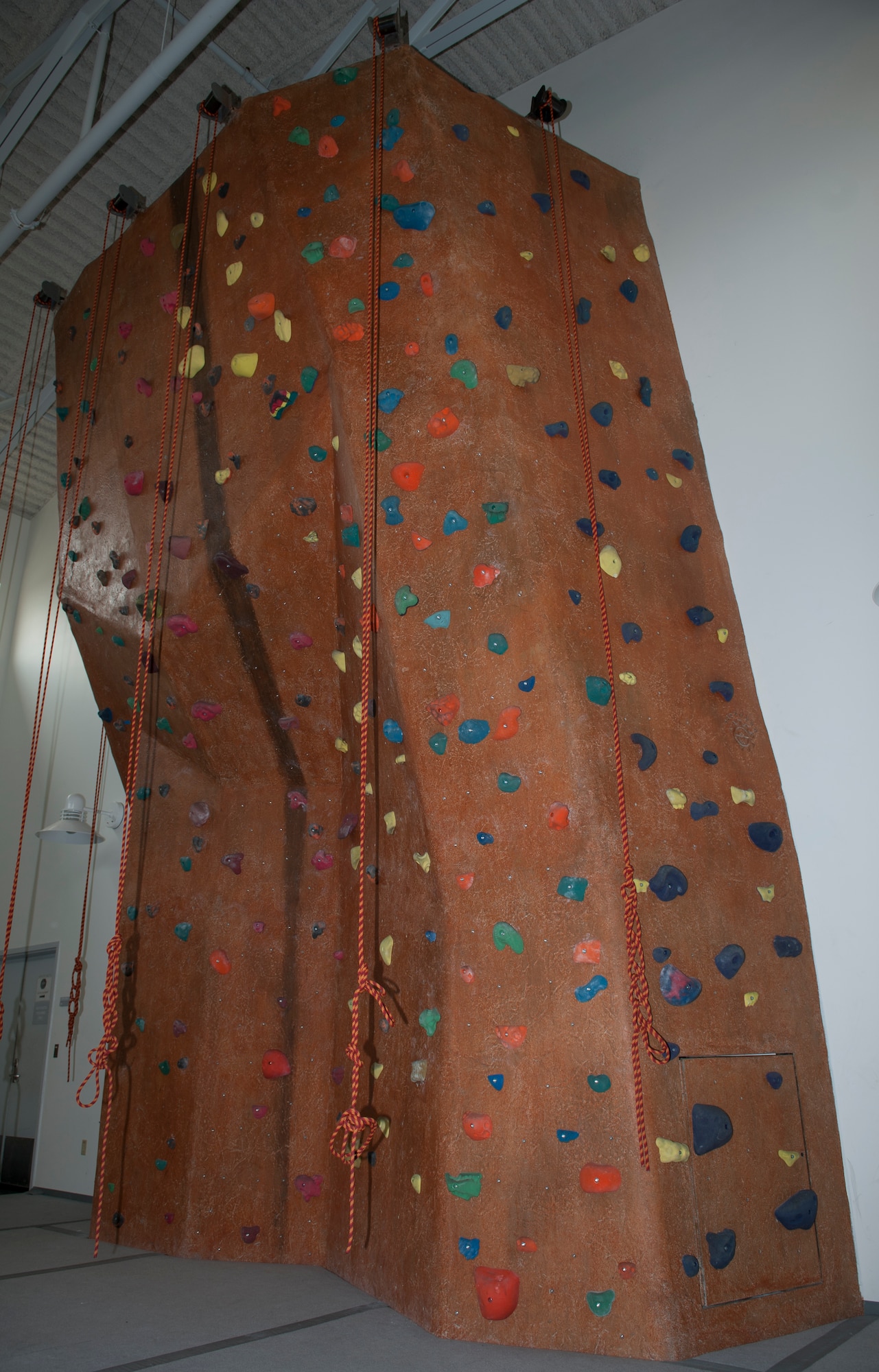 The indoor rock climbing wall sits inside the Outdoor Recreation facility May 5, 2015, at Dover Air Force Base, Del. This climbing wall is available for use for organized Squadron physical training sessions. (U.S. Air Force photo/Airman 1st Class Zachary Cacicia)
