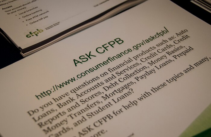 Military members received several financial information pamphlets during Holly Petraeus’ base visit on May 4, 2015 at Joint Base Charleston – Weapons Station, S.C. Petraeus is the Consumer Financial Protection Bureau Senior Federal Executive Office of Servicemember Affairs. (U.S. Air Force photo/Staff Sgt. AJ Hyatt)