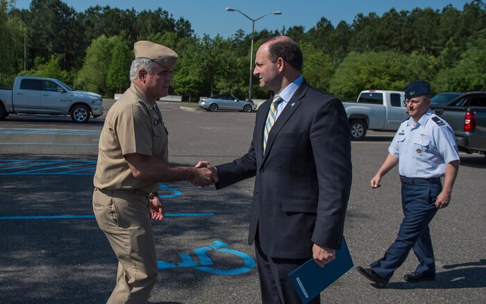 Capt. Timothy Sparks greets South Carolina Attorney General Alan Wilson during a base visit May 4, 2015 at Joint Base Charleston - Weapons Station, S.C. Wilson and Holly Petraeus, Consumer Financial Protection Bureau Senior Federal Executive Office of Servicemember Affairs, participated in a town hall meeting with Airmen and Sailors to educate them about their financial rights. Sparks is the JB Charleston deputy commander (U.S. Air Force photo/Senior Airman Jared Trimarchi)