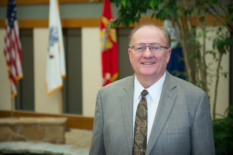 David Sparks, Air Force Mortuary Affairs Operations chaplain, poses in the atrium of the Charles C. Carson Center for Mortuary Affairs, Dover Air Force Base, Del., April 15, 2015. Sparks was named the Headquarters Air Force Manpower, Personnel and Services Specialist of the Year. (U.S. Air Force photo/Senior Airman Stacy Buckley)