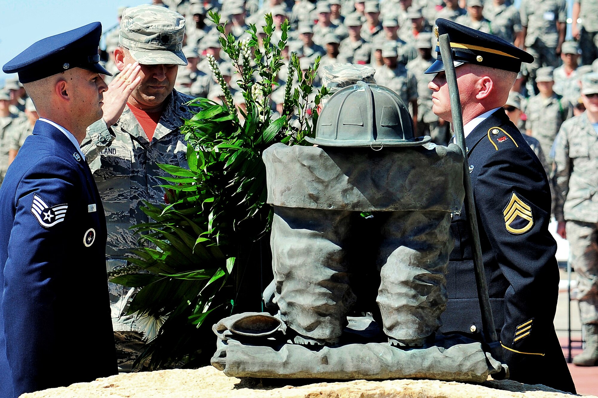 U.S. Air Force Lt. Col. Derek Ferland, 312th Training Squadron Commander, salutes after the placing of the wreath at the Department of Defense Fallen Firefighters’ Memorial on Goodfellow Air Force Base, Texas, May 1, 2015. This year’s addition to the memorial was Battalion Chief John McDonald, DOD firefighter, who died in the line of duty. (U.S. Air Force photo by Tech. Sgt. Austin Knox/Released)