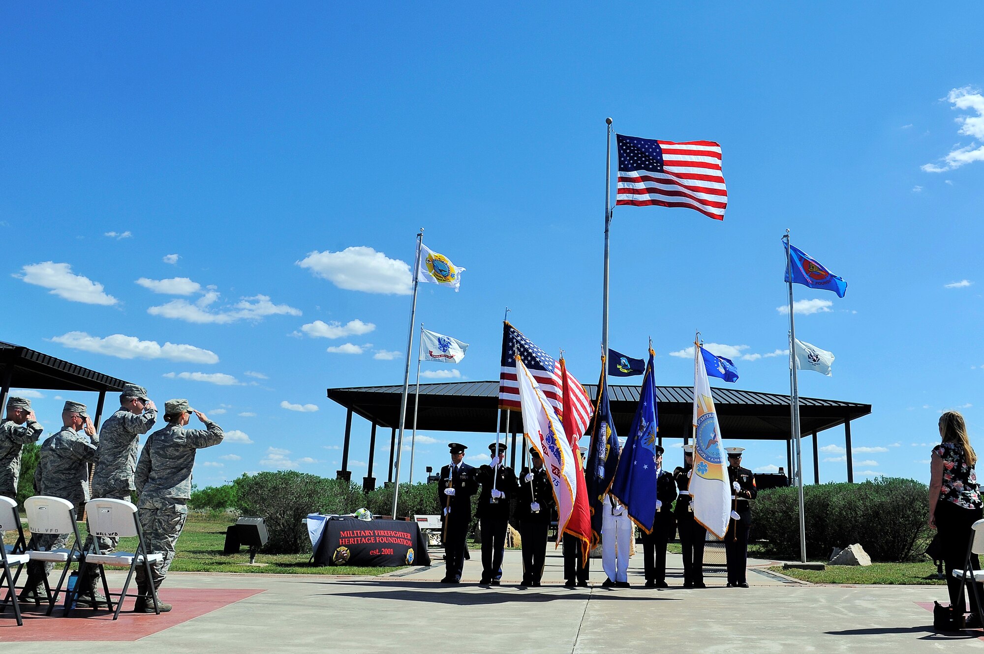The Department of Defense Fire Academy Joint Service Color Guard presents the colors for the Fallen Firefighter Ceremony at the Department of Defense Fallen Firefighters’ Memorial on Goodfellow Air Force Base, Texas, May 1, 2015. The memorial displays the names of 97 DOD firefighters who made the ultimate sacrifice while protecting those who defend America. (U.S. Air Force photo by Tech. Sgt. Austin Knox/Released)