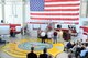 Former firefighting instructors stand-by to hammer their name tapes onto a display board at the Louis F. Garland Department of Defense Fire Academy high bay on Goodfellow Air Force Base, Texas, May 1, 2015. The academy hosted its 20th anniversary celebration honoring past and present instructors and the academy’s heritage. (U.S. Air Force photo by Tech. Sgt. Austin Knox/Released)
