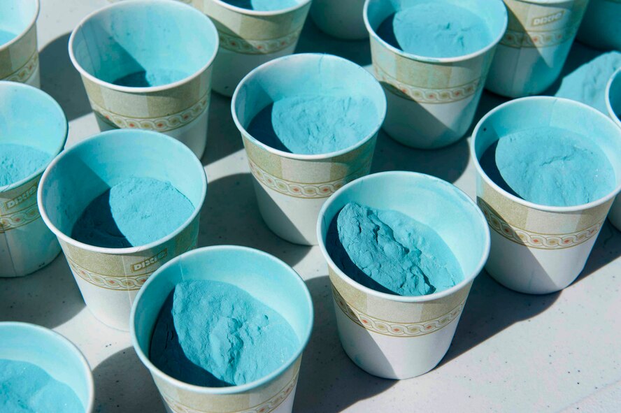 Cups of color sit on a table during the Mighty Medic Meltdown 5K/10K race on Minot Air Force Base, N.D., April 23, 2015. The 5th Medical Group hosted it in support of sexual assault prevention, child abuse prevention and alcohol awareness. (U.S. Air Force photo/Airman 1st Class Sahara L. Fales)