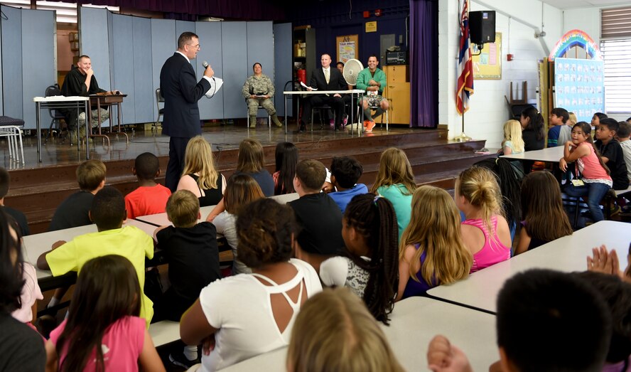 Lt. Col. David Cunningham, Pacific Air Forces Judge Advocate office chief of administrative law, makes his case to students from Aliamanu Elementary School during a mock trial for Law Day May 1, 2015. Law Day is a time to reflect on the role of law in the foundation of the country. In recognition of the event, Airmen from Joint Base Pearl Harbor-Hickam entertained the crowd of students with a brief re-telling of Jack and the Beanstalk, followed by a mock trial to determine if any crimes had been committed during Jack’s journey up and down the beanstalk. (U.S. Air Force photo by Tech. Sgt. Terri Paden)