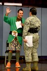 Tech. Sgt. Zachary Bolda, Pacific Air Forces Judge Advocate office NCOIC of operations & international law, is sworn in by the bailiff, Tech. Sgt. Adela Valiente-Trejo, 154th Wing Judge Advocate office paralegal, during a mock trial for Law Day at Aliamanu Elementary School, May 1, 2015. Law Day is a time to reflect on the role of law in the foundation of the country. In recognition of the event, Airmen from Joint Base Pearl Harbor-Hickam entertained the crowd of students with a brief re-telling of Jack and the Beanstalk, followed by a mock trial to determine if any crimes had been committed during Jack’s journey up and down the beanstalk. (U.S. Air Force photo by Tech. Sgt. Terri Paden)