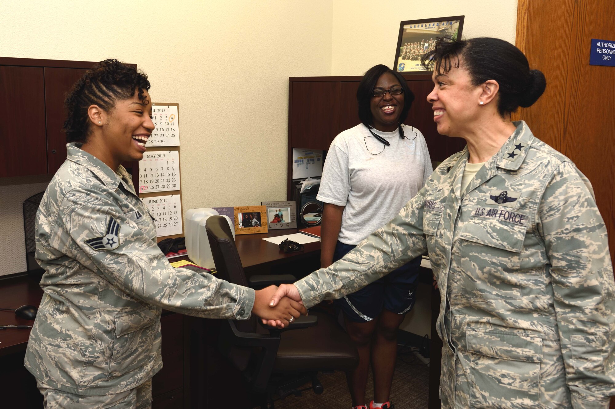 Maj. Gen. Stayce D. Harris, 22nd Air Force commander, receives a greeting from Senior Airman Reba Liberty, 403rd Aeromedical Staging Squadron health service management journeyman, during her tour for the 403rd ASTS May 3, 2015, at Keesler Air Force Base, Mississippi. Harris visited the 403rd Wing May 1-4, 2015, to interact with the Citizen Airmen and gain a better understanding of the organization and the wing’s mission. (U.S. Air Force photo/Tech. Sgt. Ryan Labadens)