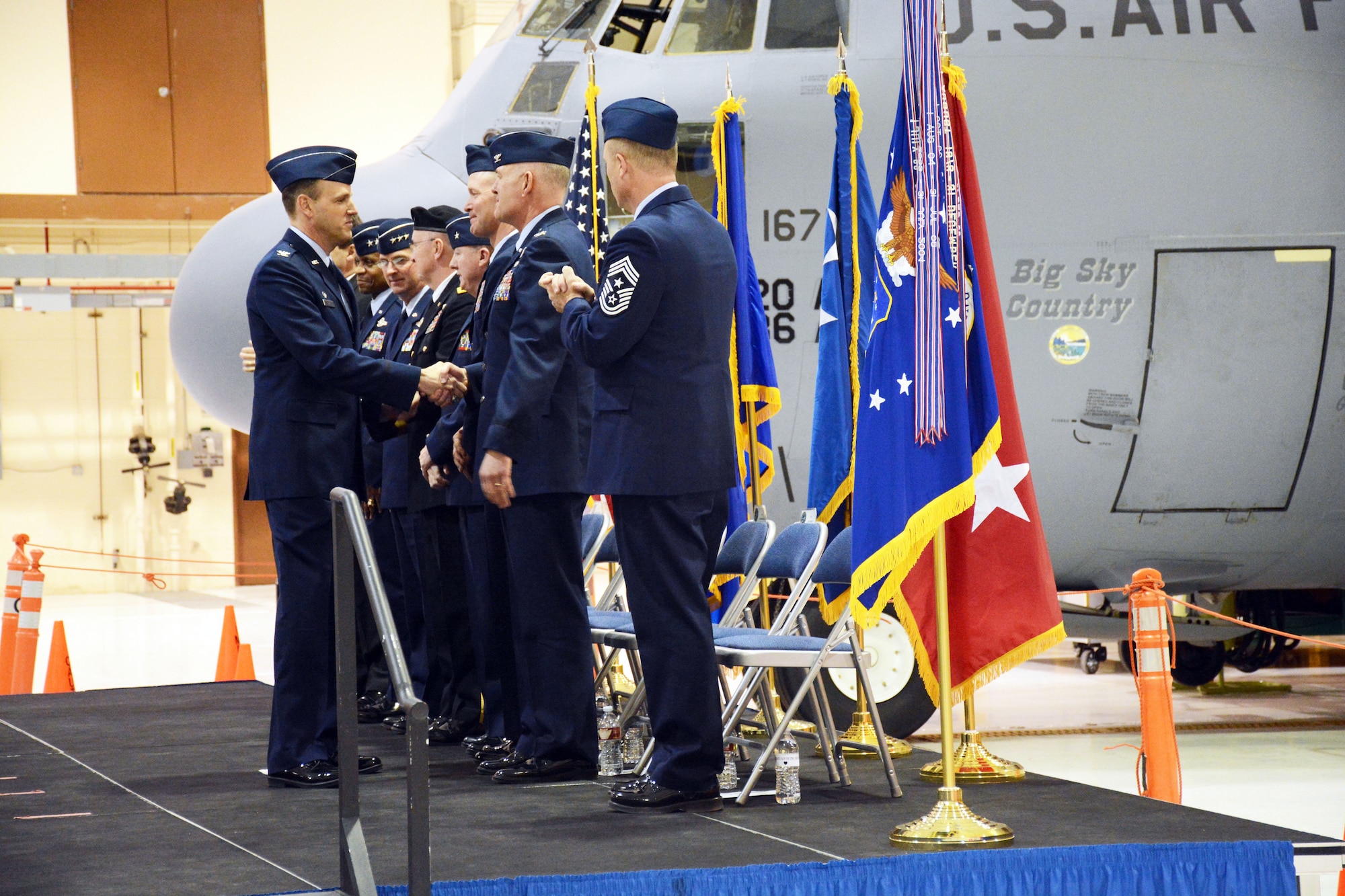 Col. Lee Smith shakes hands with Col. J. Peter Hronek at the conclusion of the 120th Airlift Wing’s change of command ceremony March 7, 2015. (Montana Air National Guard photo/Senior Master Sgt. Eric Peterson) 