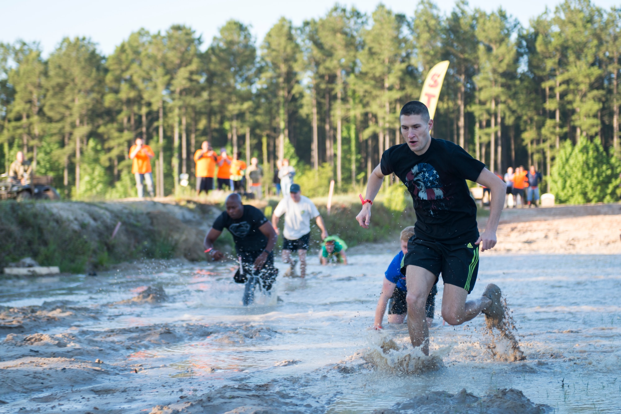 U.S. Air Force Maj. Jonathan Czarney, 23d Contracting Squadron commander, sprints through the starting mud pit during the 2015 Moody Mudder May 2, 2015, in Ray City, Ga. More than 400 Moody Airmen and community members participated in the annual run.
(U.S. Air Force photo by Airman 1st Class Dillian Bamman/Released)
