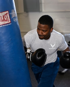 Airman 1st Class Onnie McSpadden works out with a heavy bag in the gym at Selfridge Air National Guard Base, Mich., April 28, 2015. McSpadden is a former boxer who now serves as a member of the 127th Wing, Michigan Air National Guard at Selfridge. (U.S. Air National Guard photo by Terry Atwell)