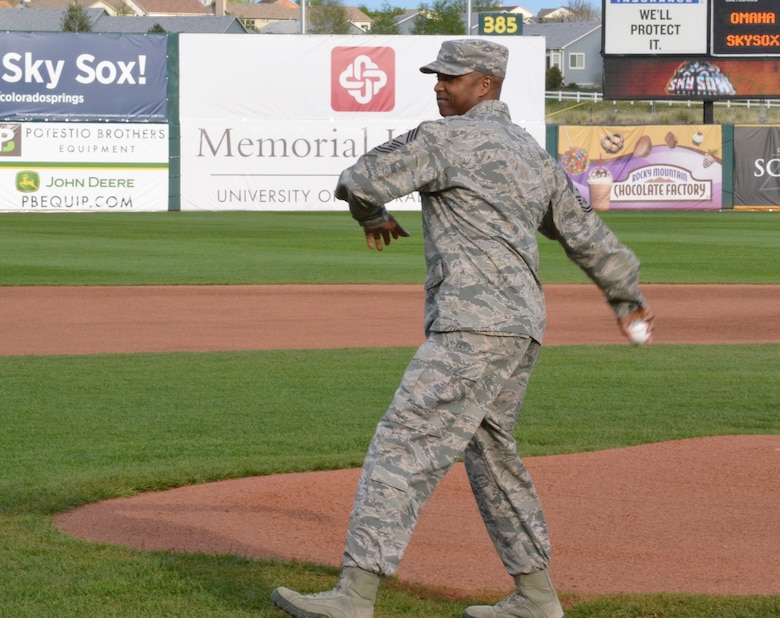 Chief Master Sgt. Lavon Coles, former 50th Space Wing command chief, throws out the first pitch prior to the Colorado Springs Sky Sox game May 1, 2015, at Security Service Field, Colo. The pitch was part of the Sky Sox Military Appreciation Night festivities. (U.S. Air Force photo/Brian Hagberg)