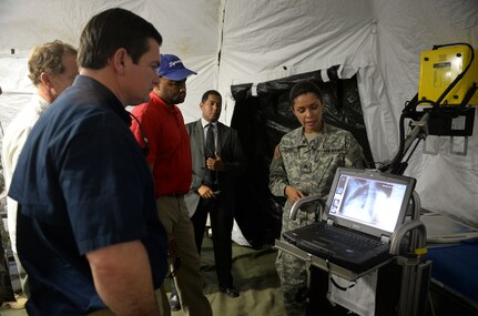 SOTO CANO AIR BASE, Honduras – Sgt. Stephanie Tucker, a Medical Element radiologist, explains Joint Task Force – Bravo’s ability to conduct x-rays in an expeditionary environment to a bi-partisan, congressional delegation from the House Armed Services Committee May 4, 2015, at Soto Cano Air Base, Honduras. The delegation learned of JTF-B’s ability to conduct transportation, sustainment and medical operations in austere environments, in support of the broader U.S. and partner nation stabilization efforts in Central America. (U.S. Air Force photo by Staff Sgt. Jessica Condit)