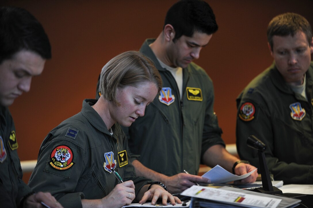 Aircrew personnel from the 37th Bomb Squadron prepare for a training mission during the Green Flag exercise at Ellsworth Air Force Base, S.D., April 29, 2015. Green Flag is a large force exercise designed to provide combat training to joint and coalition warfighters in the art of air-land integration and the joint employment of airpower at the U.S. Army National Training Center at Fort Irwin, Calif. (U.S. Air Force photo by Senior Airman Anania Tekurio/Released)