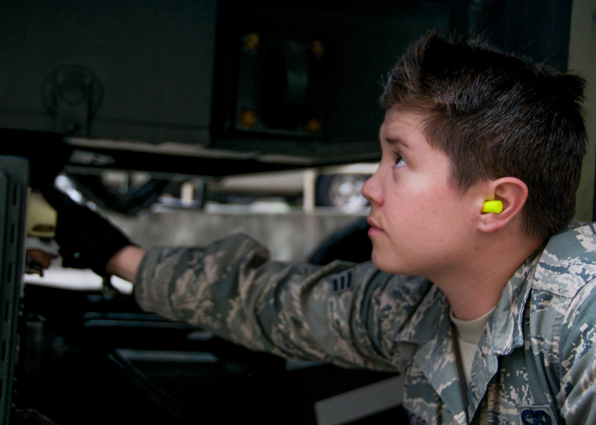 Senior Airman Claire Requiroso, 67th Aerial Port Squadron, checks a heavy equipment loader to ensure it is running properly. Requiroso, and 11 Airmen from the 67th APS trained on several different pieces of equipment while working at Hurlburt Field, Fla., during their two-weeks of annual training. (U.S. Air Force photo/Staff Sgt. Crystal Charriere)