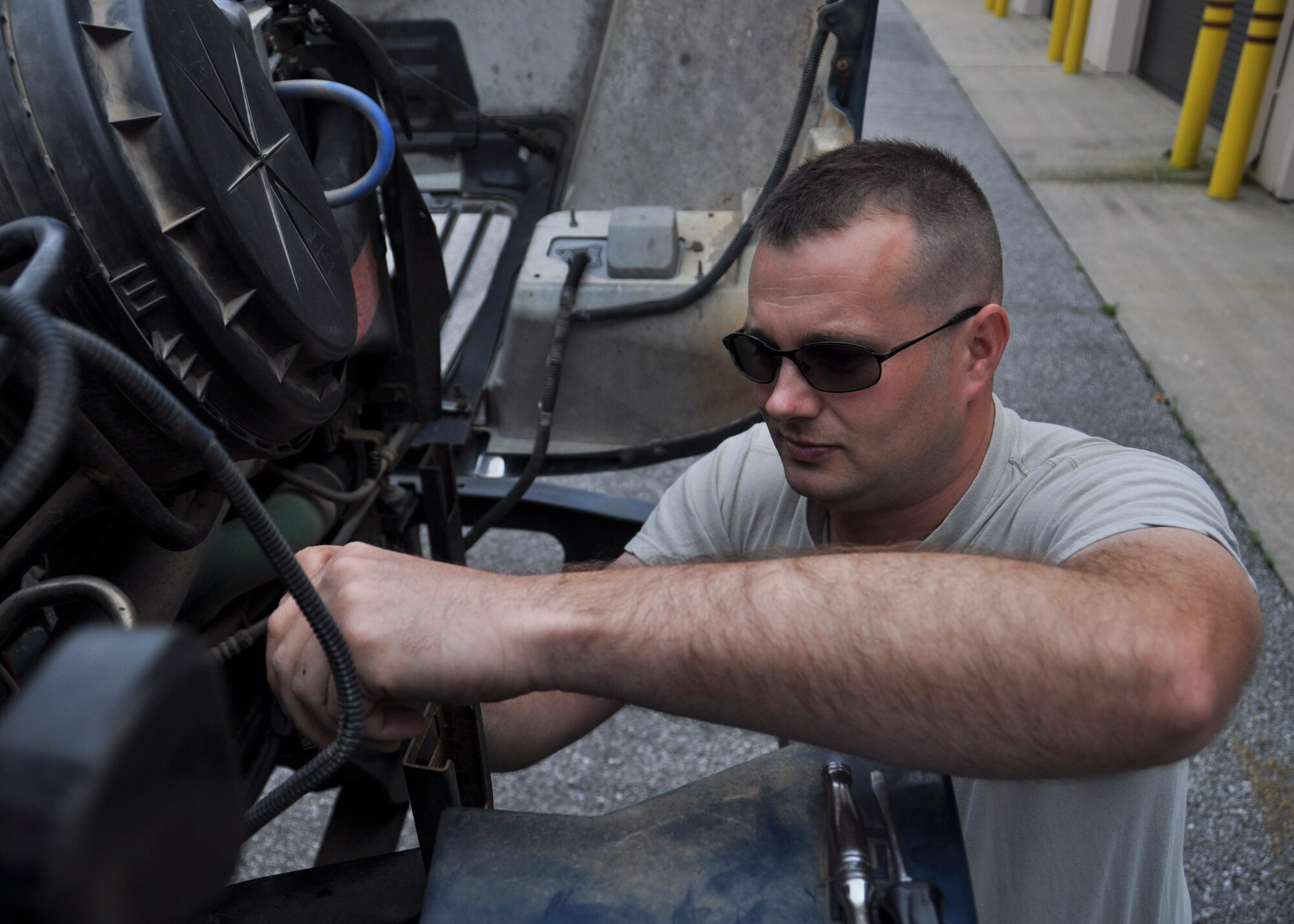 Vehicle maintainer Tech. Sgt. Riley Williams, of the 419th Logistics Readiness Squadron, repairs  a truck at Hurlburt Field, Fla., during his two-week annual training. He and a team of eight other Hill Air Force Base, Utah, reservists helped increase Hurlburt Field’s vehicle readiness by 4 percent. Many work as civilian mechanics and were able to leverage that experience, along with their military training.  (U.S. Air Force photo/Staff Sgt. Crystal Charriere)