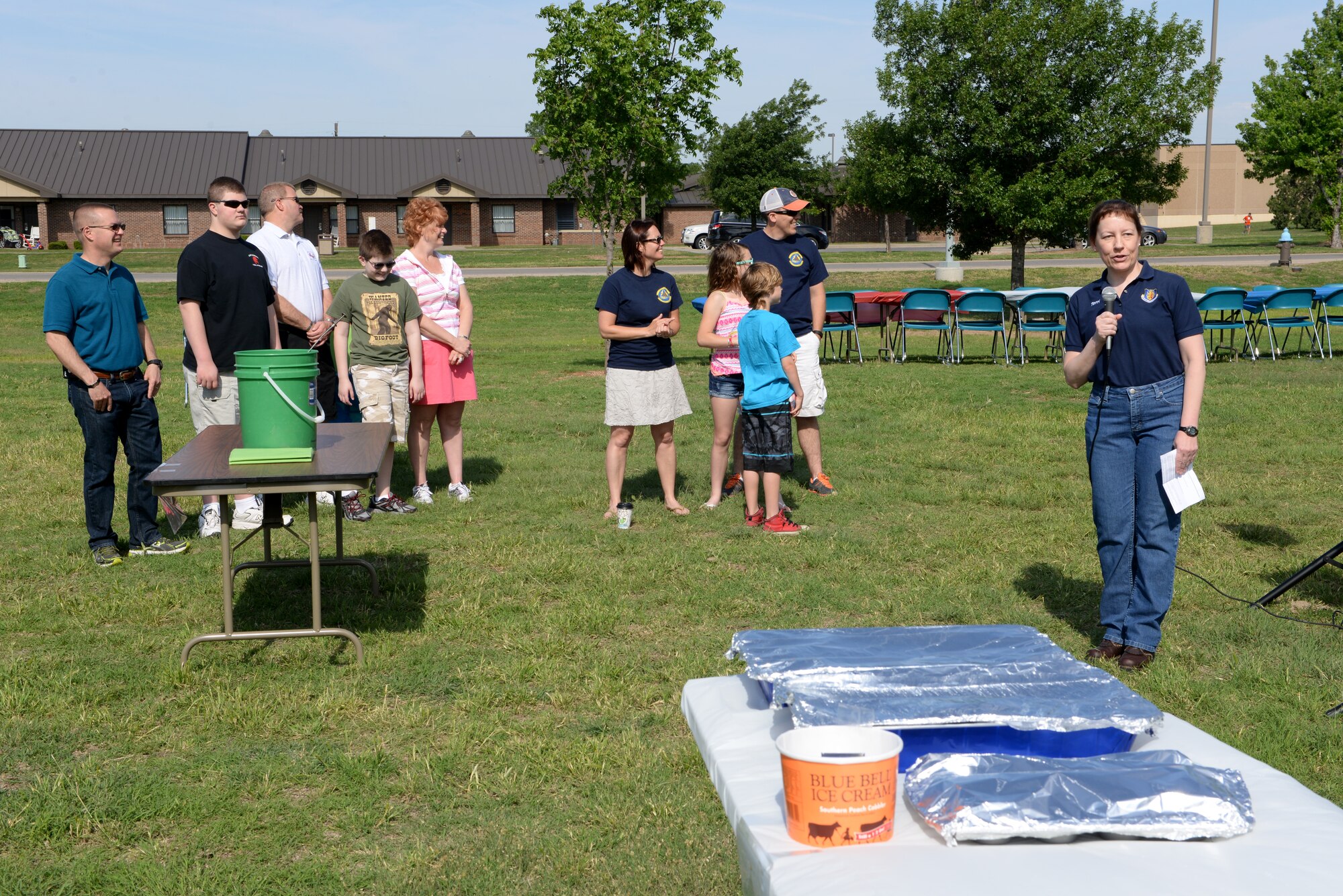 ALTUS AIR FORCE BASE, Okla. – U.S. Air Force Col. Terri Jones gives opening remarks at a deployed family event, May 2, 2015, near the mini-golf course. The purpose of the event was to provide deployed families with information on the services available to them as well as to show appreciation for the struggles they face while their loved one is away. (U.S. Air Force photo by Airman 1st Class Megan E. Acs/Released)