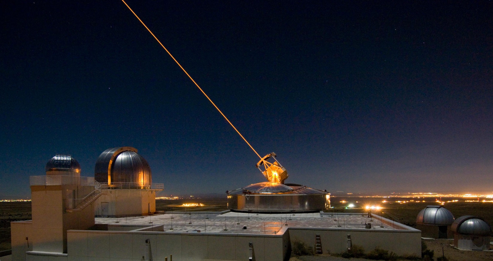 The Sodium Guidestar at the Air Force Research Laboratory's Starfire Optical
Range resides on a 6,240 foot hilltop at Kirtland AFB, N.M. Researchers with
AFRL's Directed Energy Directorate use the Guidestar laser for real-time,
high-fidelity tracking and imaging of satellites too faint for conventional
adaptive optical imaging systems. Directed-Energy and Electro-Optics for
Space Superiority (DEOSS) is one of 26 ground-breaking AFRL technologies
which will be demonstrated during DoD Lab Day, May 14 at the Pentagon
Courtyard. (U.S. Air Force photo)

