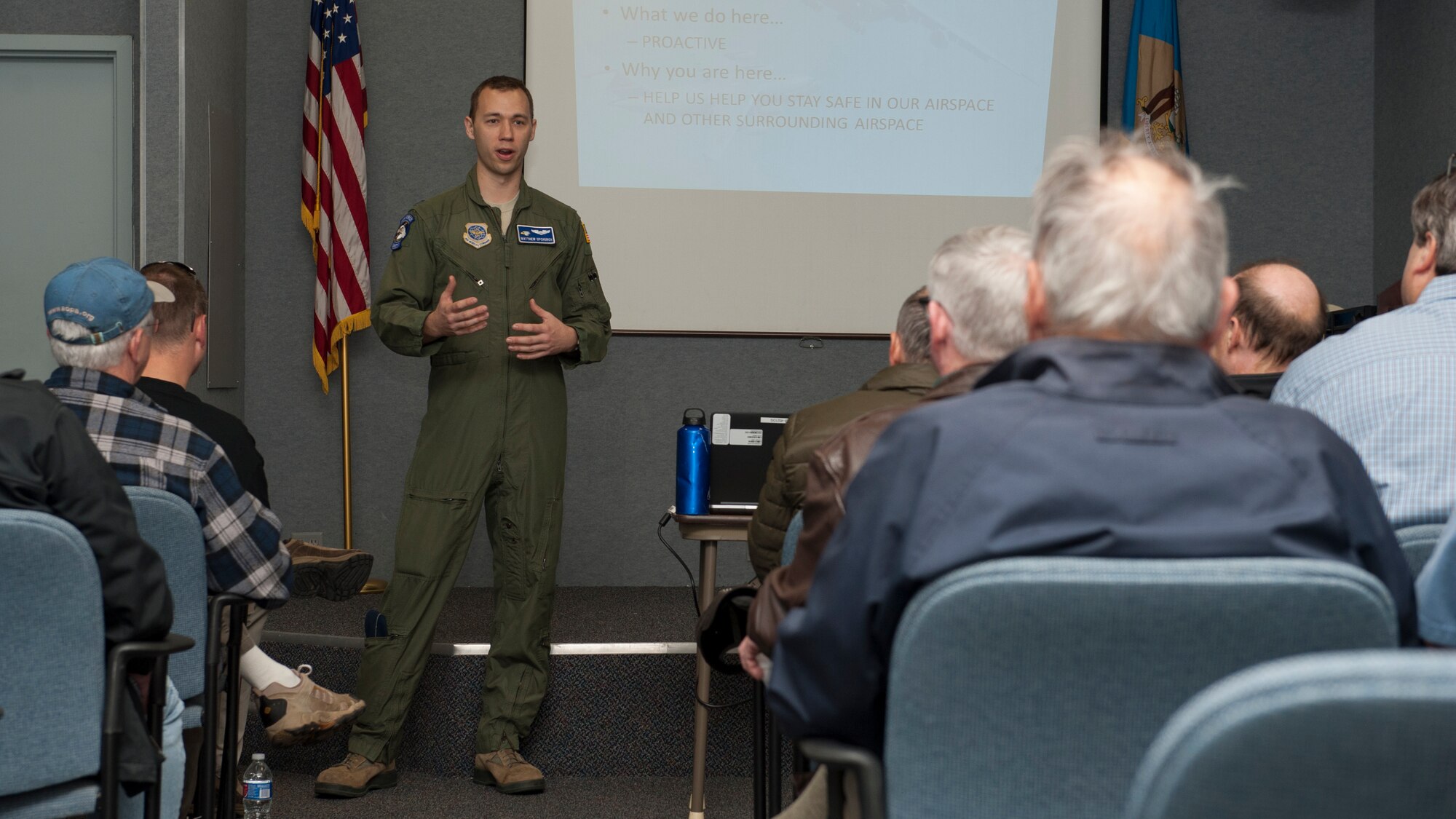 Capt. Matt Upchurch, 436th Airlift Wing flight safety officer, presents a safety brief during the 2015 Dover Air Force Base Mid-Air Collision Avoidance Fly-in May 2, 2015, at Dover AFB, Del. Upchurch was the primary facilitator and organizer of the event. (U.S. Air Force photo/Airman 1st Class Zachary Cacicia)