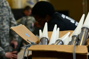 Members of Joint Task Force-Civil Support maneuver through a processing line as part of exercise Vibrant Response 15 at Fort Eustis, Va., April 30, 2015. VR 15 is a major joint training exercise taking place at Camp Atterbury, Ind., and Jefferson City, Mo. (U.S. Air Force photo by Senior Airman Kimberly Nagle/Released)  