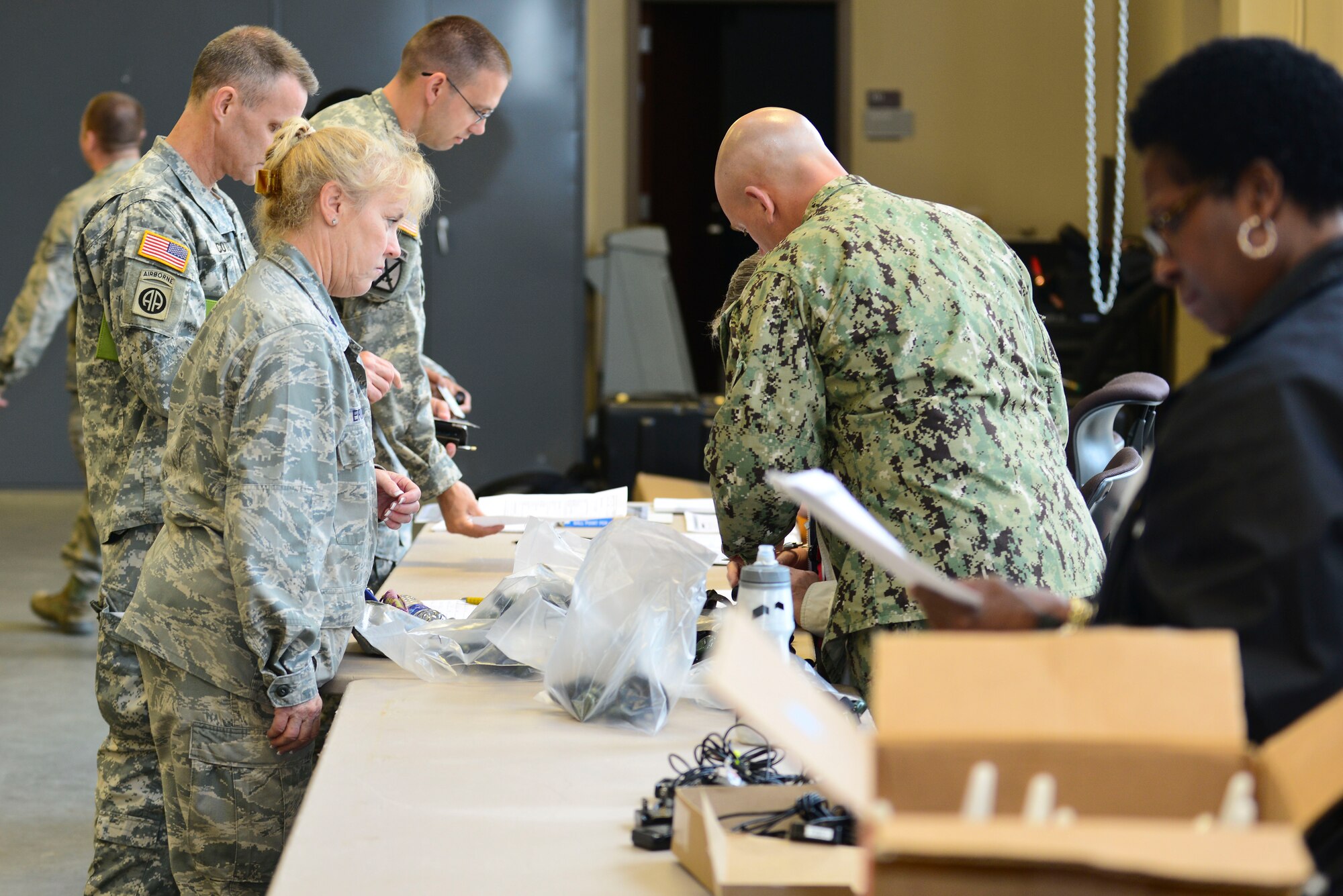 U.S. Service members assigned to Joint Task Force-Civil Support make their way through a processing line during exercise Vibrant Response 15 at Fort Eustis, Va., April 30, 2015. The exercise will evaluate more than 140 members of JTF-CS headquarters and 610 members of the Defense Chemical, Biological, Radiological and Nuclear Response Force on consequence management operations after a CBRN event.  (U.S. Air Force photo by Senior Airman Kimberly Nagle/Released)  