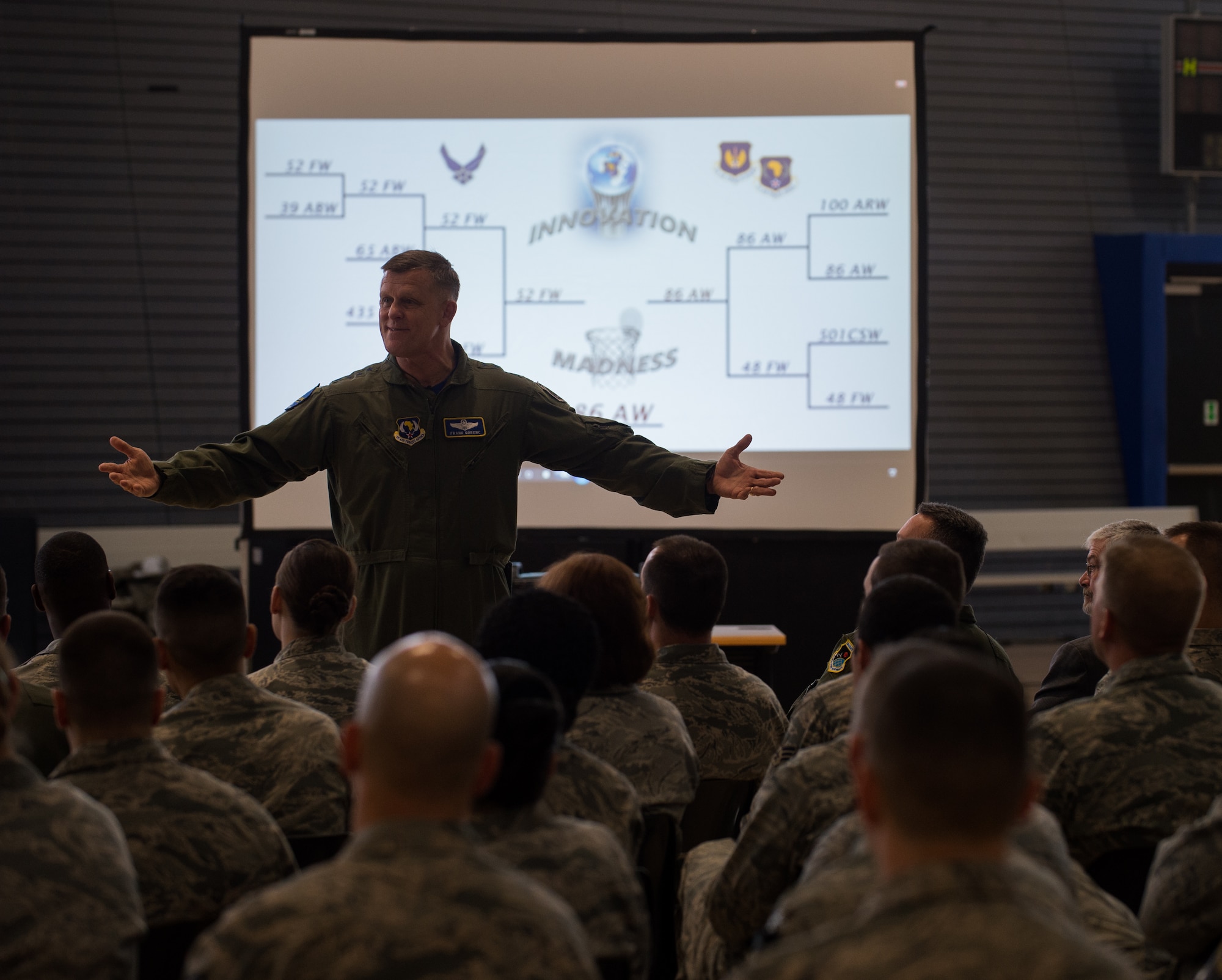 Gen. Frank Gorenc, U.S. Air Forces in Europe and Air Forces Africa commander, congratulates  86th Airlift Wing Airmen for winning the first Innovation Madness tournament May 1, 2015, at Ramstein Air Base, Germany. The inaugural competition started with nine wings from around USAFE-AFAFRICA competing in a tournament style match to determine which wing promotes the best innovative culture. Each wing submitted their innovative ideas along with the money and man-hours saved. Those ideas also included ways their units completed the mission in more efficient ways. In total, the nine wings submitted 477 innovations, saving the Air Force at least $28 million and 115,000 man-hours a year. (U.S. Air Force photo/Senior Airman Jonathan Stefanko)