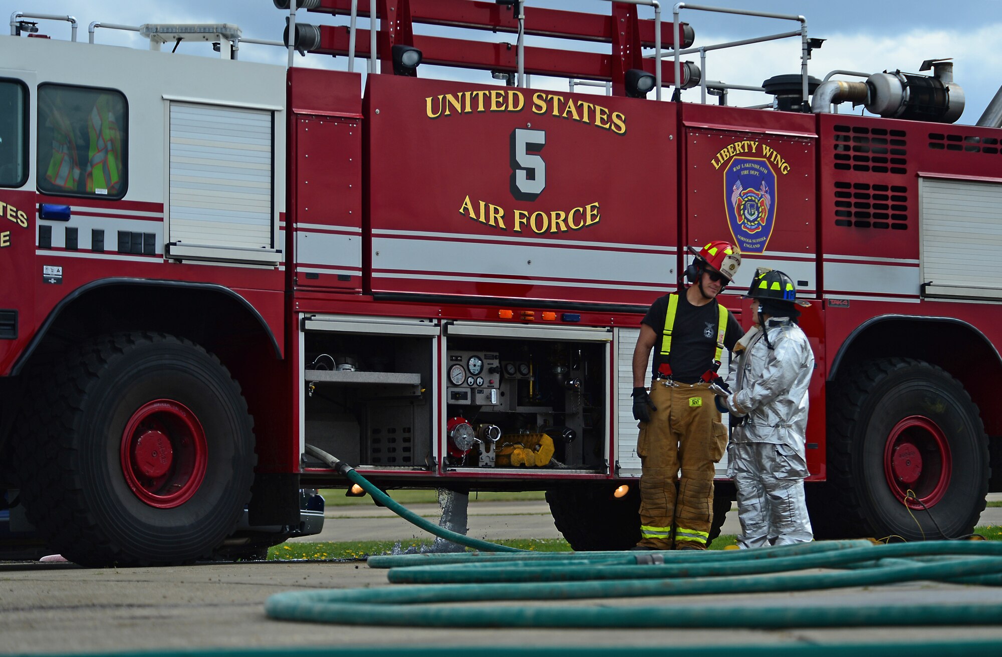 A firefighter assigned to the 48th Civil Engineer Squadron spends time with his wife during a spouses’ day at Royal Air Force Lakenheath, England, May 1, 2015. The event allowed firefighter’s spouses to experience what work at the station entails and provided a better understanding of daily responsibilities. (U.S. Air Force photo by Senior Airman Erin O’Shea/Released) 