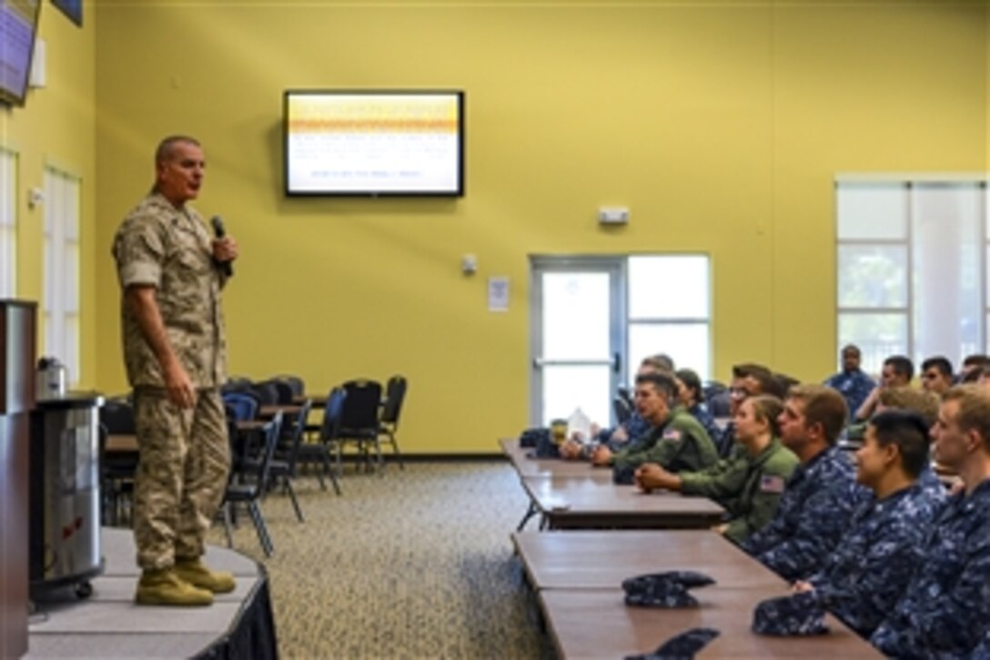 Marine Corps Sgt. Maj. Bryan B. Battaglia, senior enlisted advisor to the chairman of the Joint Chiefs of Staff, addresses sailors and Marines during an all-hands call on Naval Air Station Jacksonville, Fla., May 4, 2015. The sergeant major stopped at the base as part of his six-day visit to the area where he has been promoting the Defense Department’s partnership with the PGA Tour and nonprofit organizations helping veterans.