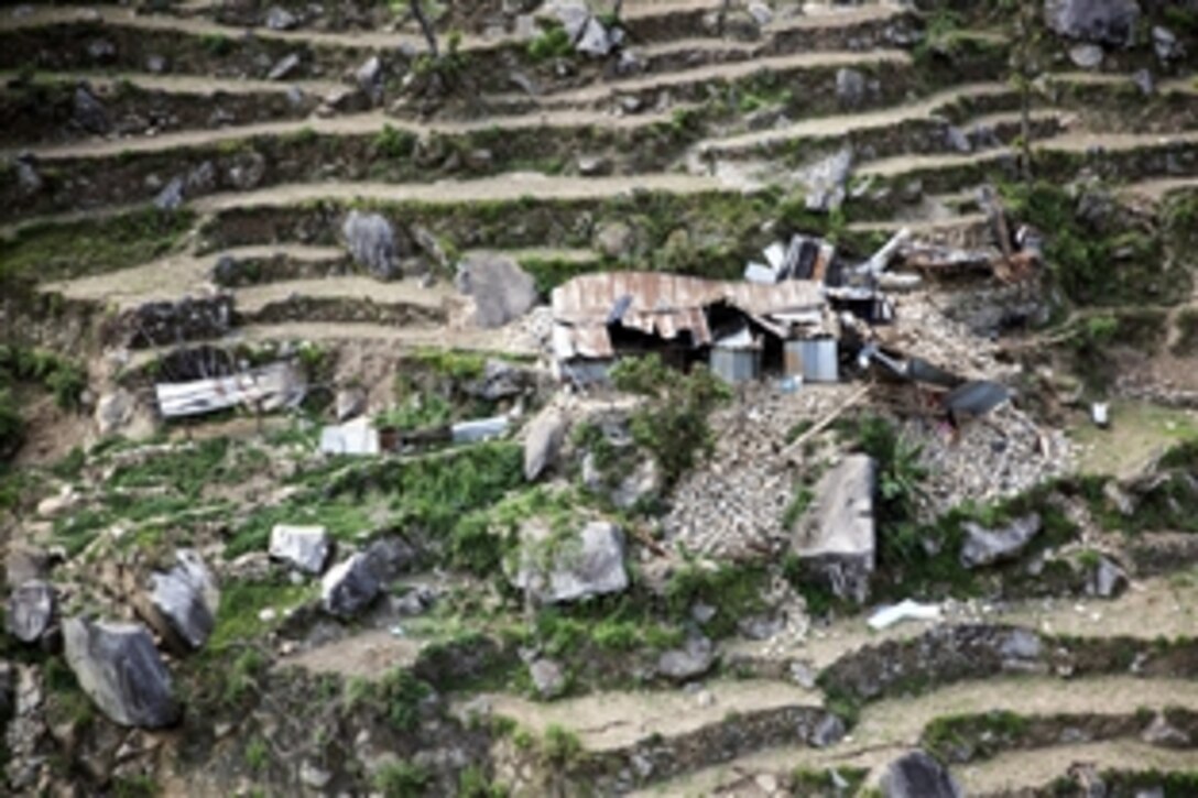 The view from a UH-1Y Huey shows the rubble of a home in Kathmandu, Nepal, May 4, 2015. The flight was part of a reconnaissance mission to survey the outlying areas of Nepal affected by the magnitude-7.8 earthquake, April 25. Marines, assigned to Marine Light Attack Helicopter Squadron 469, Marine Air Group 36, 1st Marine Aircraft Wing, 3rd Marine Expeditionary Force, provided the UH-1Y Huey to support Nepal's government. 