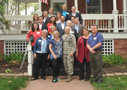 U.S. Air Force Lt. Gen. James M. Kowalski (front center), U.S. Strategic Command deputy commander, and his wife, Julie Kowalski (front center left), welcome the 2015 Omaha Executive Institute delegation to Offutt Air Force Base, Neb., May 5, 2015. The annual OEI visit is part of USSTRATCOM's ongoing effort to build and maintain enduring relationships with partner organizations from Omaha and the surrounding communities, as well as those from academia and allied nations. The OEI is a Greater Omaha Chamber of Commerce Foundation program which introduces new senior-level executives and their spouses to the issues, challenges and opportunities in the Omaha community. USSTRATCOM is one of nine DoD unified combatant commands and is charged with strategic deterrence; space operations; cyberspace operations; joint electronic warfare; global strike; missile defense; intelligence, surveillance and reconnaissance; combating weapons of mass destruction; and analysis and targeting. (USSTRATCOM photo by Steve Cunningham)